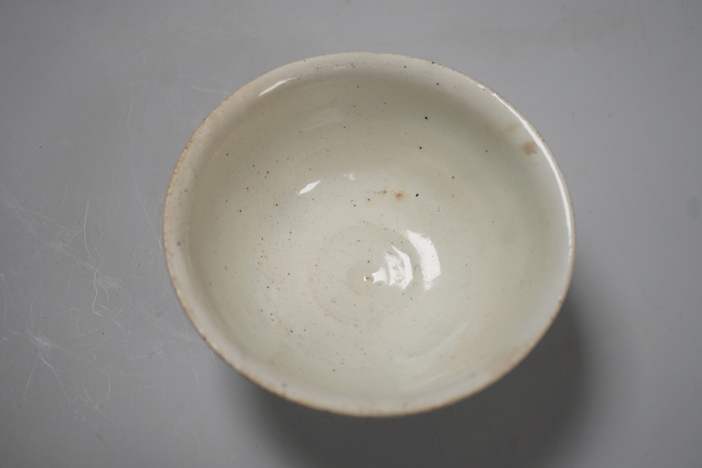 A Chinese blue and white ‘lotus’ charger, together with a bowl and dragon pot on tripod base